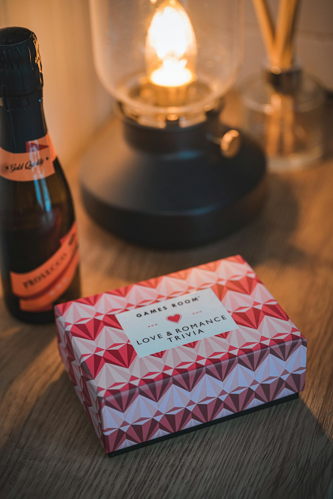 Prosecco bottle and romance trivia game box.